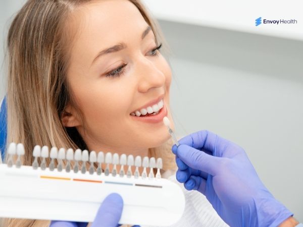 Dentist performing Veneers shade matching 